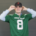 Portrait of Trevor Berry in a New York Jets jersey and an Alabama college hat